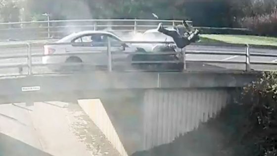 Biker flung over bridge in dramatic footage as two cars crash in head-on collision – MASHAHER