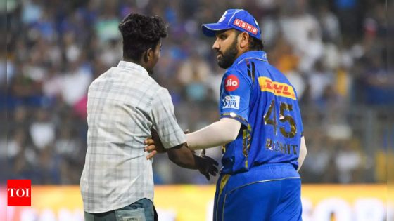 Watch: Fan invades field, scares Rohit Sharma during MI vs RR match | Cricket News – MASHAHER