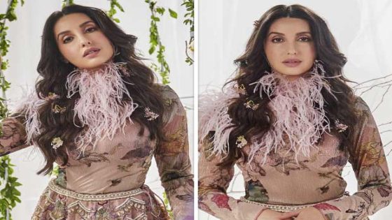 Nora Fatehi dazzles in classic metallic silk lehenga by Varun Bahl paired with bodysuit and pink feather collar : Bollywood News – MASHAHER