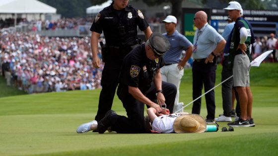 Six climate protesters run onto 18th green and spray powder, delaying finish of PGA Tour event – MASHAHER