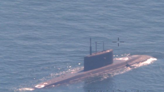 A NATO sub hunter captured these shots of a Russian submarine in waters newly surrounded by the alliance – MASHAHER