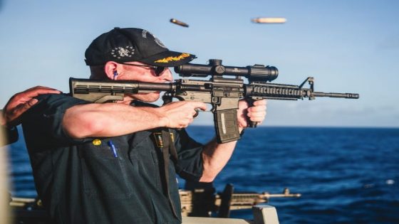 A US Navy warship commander was relieved of duty over a ‘loss of confidence’ 4 months after he was photographed firing a rifle with a backward scope – MASHAHER