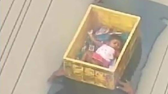 Baby In Plastic Crate Carried By Men In Andhra Flood Waters – MASHAHER