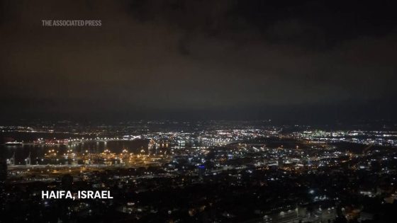 Security personnel clear rubble after sirens and blasts heard in Haifa, northern Israel – MASHAHER